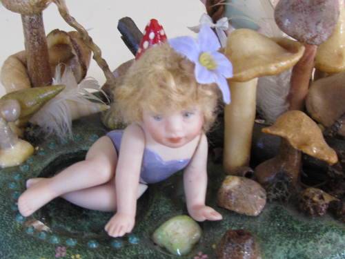 3 miniature fairy dolls in a mushroom garden (larger than 1:12" scale)