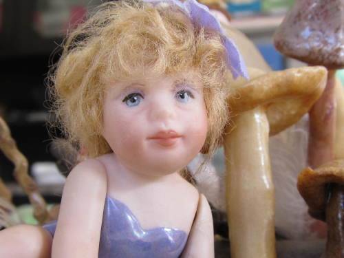 3 miniature fairy dolls in a mushroom garden (larger than 1:12" scale)