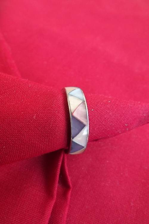 Multi colour mother of pearl band ring in triangles.Rhodium plated.Size 9.5.New condition