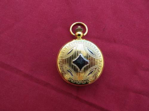 Beautiful gold toned quartz pocket watch.Roman and normal letters.Working.New condition