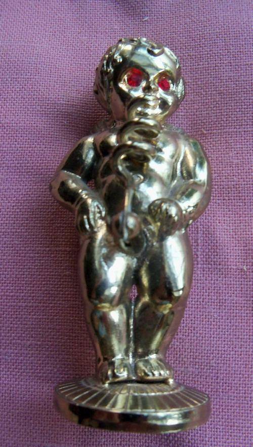 Brass corkscrew-boy with red stone eyes