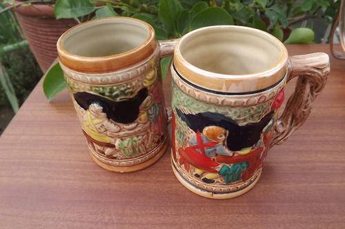 Pair of German style Porcelain Mugs - see scan. Good condition