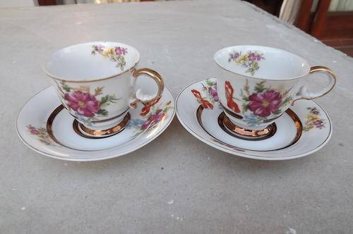 Set of 2 stunning small S.K. makers porcelain cups and saucers.Wide gilded rims.