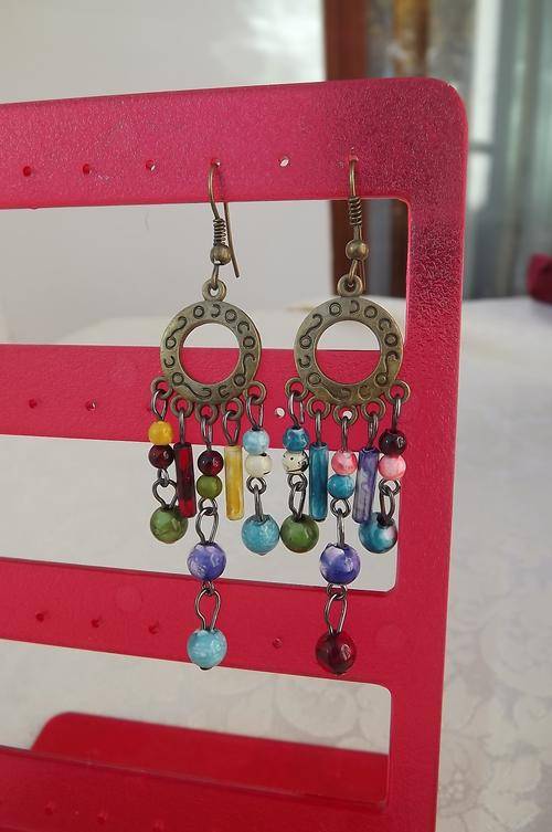 Pretty brass piercing earrings with hanging beads.New-never used