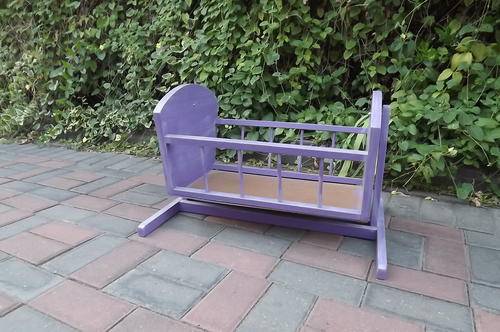 Cot cradle for doll in wood 57cm * 39cm,height 39cm.In good condition.