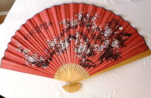 Extra Large, decorative, Chinese wall fan. Red with blooming cherry branch and Chinese characters.