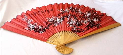 Extra Large, decorative, Chinese wall fan. Red with blooming cherry branch and Chinese characters.