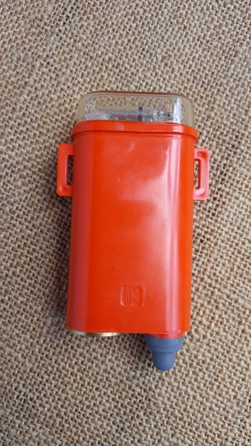 clean & unused old-gen SDU5/E strobe (distress marker) in original box with (used) battery - intact