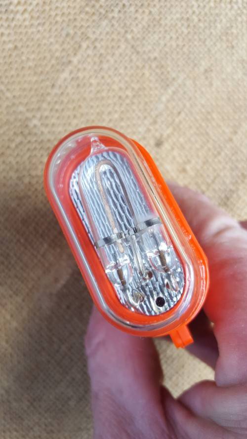 clean & unused old-gen SDU5/E strobe (distress marker) in original box with (used) battery - intact