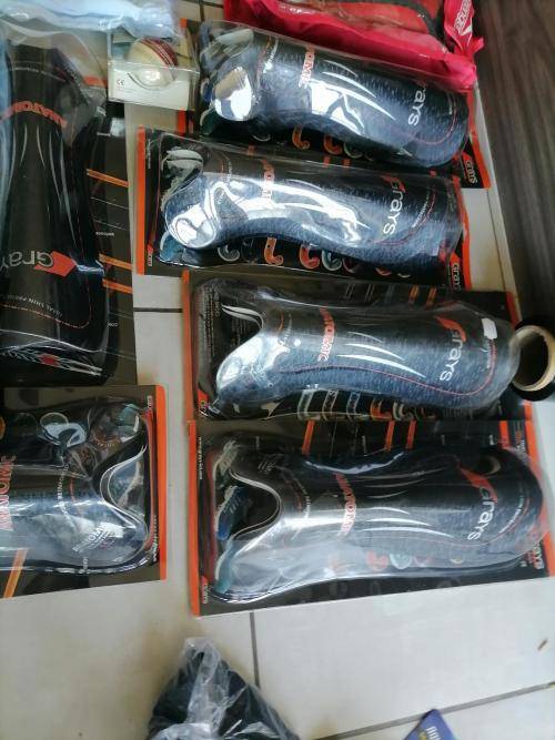 **HUGE SPORT SHOP LIQUIDATION*LOT OF BRAND NEW SHIN GUARDS,GLOVES,CRICKET PANTS ETC ETC**