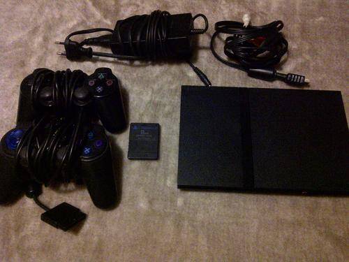 Playstation 2 + 10 Games of your choice !!