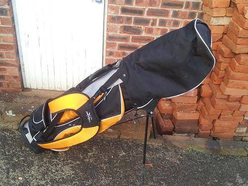 Maxed Black and Orange Clubs and Bag with stand