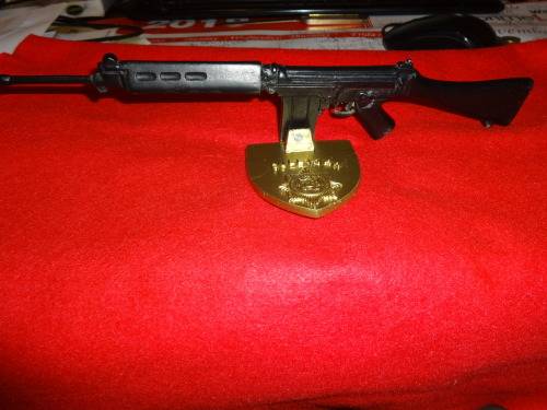 R1 RIFLE MOUNTED ON OLD SOUTH AFRICAN POLICE BADGE