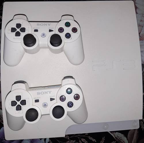 Playstation 3 with 2 controls and 9 games