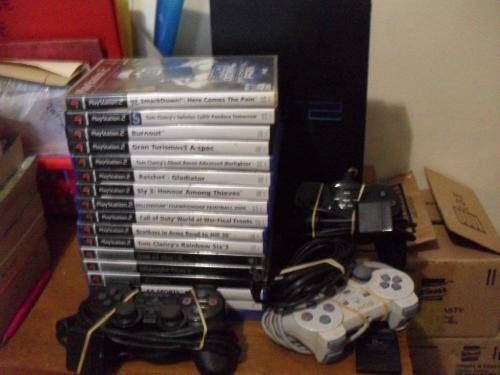 PS2 CONSOLE...3 REMOTES 8MB MEMORY CARD AND 17 GAMES