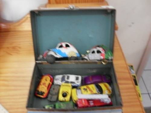 A SUITCASE WITH SOME COLLECTABLE CARS