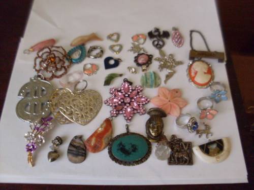 A COLLECTION OF VARIOUS PENDANTS ETC ETC ETC