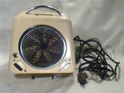 A Old Vintage 220V " Coxy Glo " Heater with fan, in good working condition.