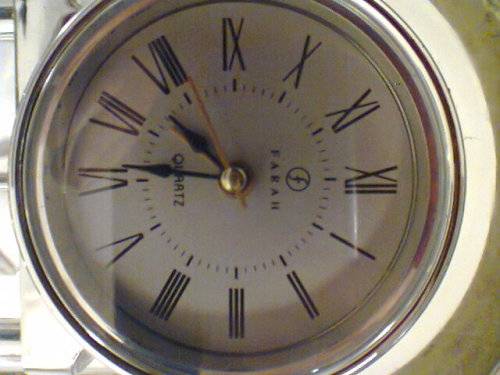 A "Recardo"& "Farah" mantel Clock's with a Alarm's & a Key ring set with Light. Watches are working.