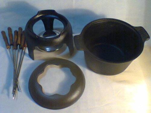 A Almost new never Used Cast Iron complete "Premier FONDUE set" Ready for U to set out at the party.
