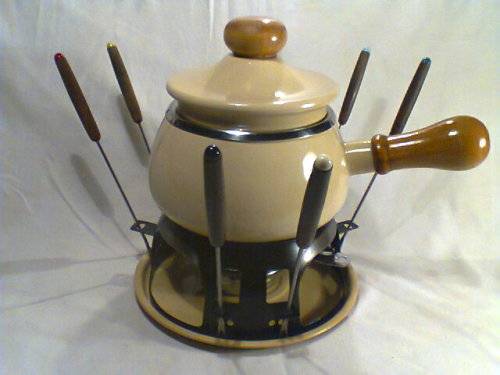 A Almost new/Used complete Enamel "FONDUE set" in Original Box. Ready for U to set out at the party.