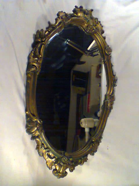 A Bevelled Gold framed Vintage Oval Mirror Size:700mm Tall x 430mm Wide.In used Second hand Order