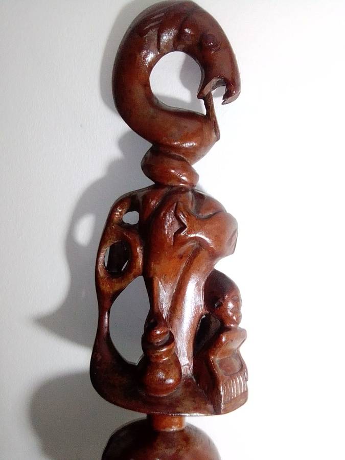 The Nyami nyami is described as having the body of a snake the head of a fish. Ethnic Walking Stick.