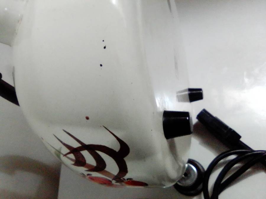 A Hendlers whistling white Enamel manual 3 footed electric 3Lt Kettle a flower motif.