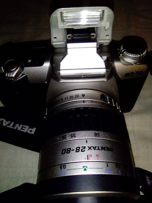 A Pentax AZ50 with 28-80mm lens in carry bag. In fair used condition.