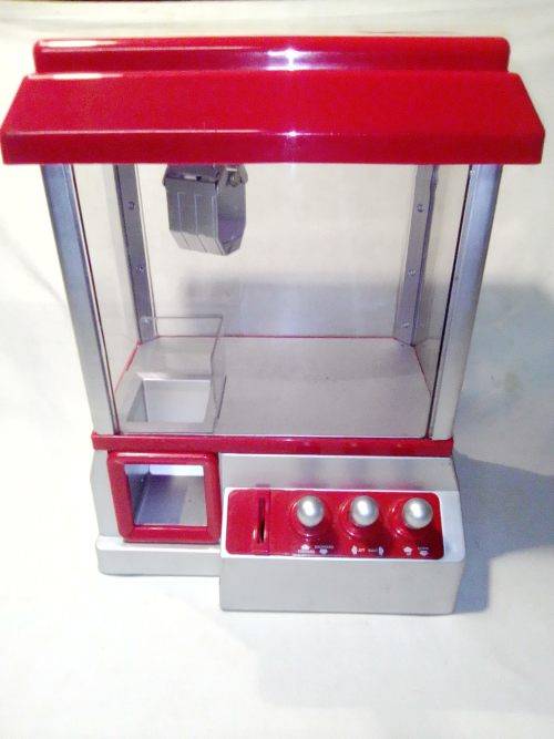 A `Toy Grab Machine` been in storage a long time bu still in good condition for age.