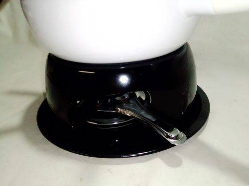 Brand New and clean. An Estate find, a German, Complete and boxed white enamel Fondue.