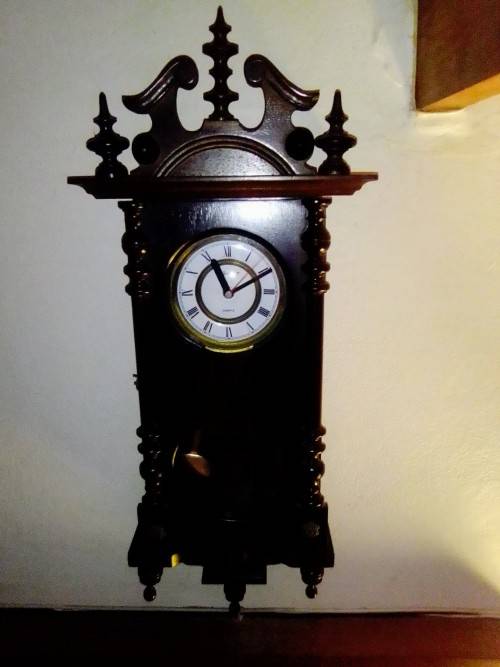 A clean dark wood working Quarts `Blessing` Wall Clock. In good condition.