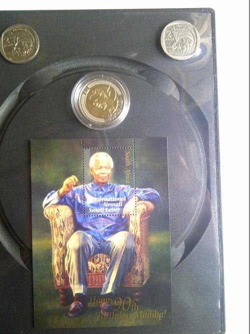 Mandela: R5 UNC 90th Birthday Capsulated coin and sitting stamp, 2 x R2 ten years of freedom coins