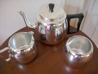 SILVER METAL TEA SET.