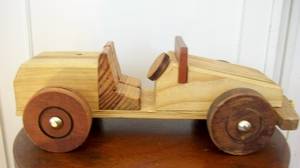 SOLID WOOD TOY CAR.