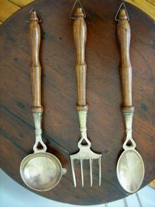 A SET OF BRASS KITCHEN UTENSILS