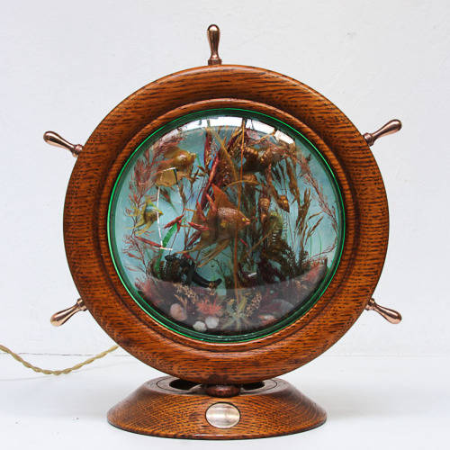 UNUSUAL LIGHT OF A SHIP WHEEL CONTAINING AN AQUARIUM - OAK, BRASS, PERSPEX - 1970's