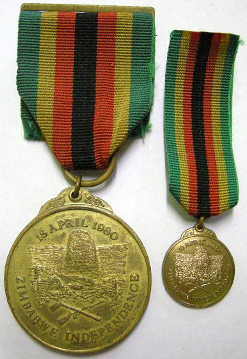 Zimbabwe Independence Medal Full Size Numbered on Rim 14496 + Miniature