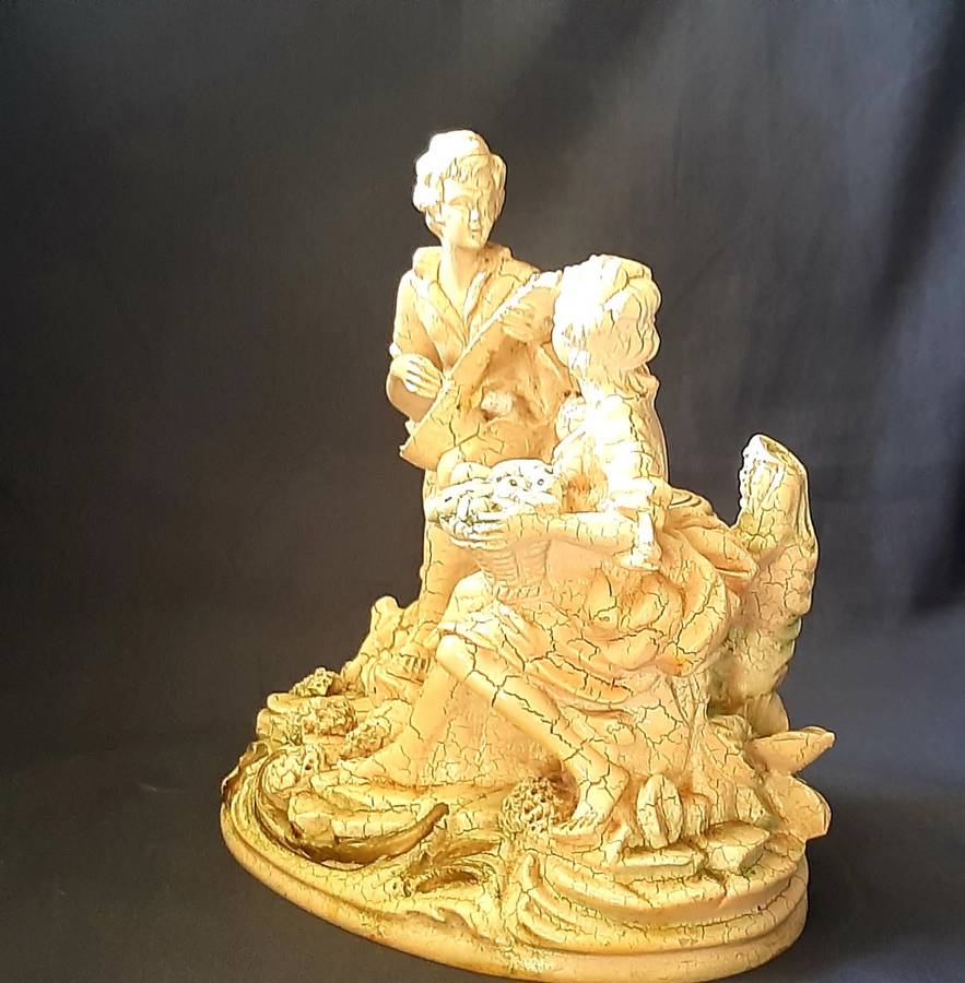 VINTAGE STATUE OF MAN SERENADING A WOMAN