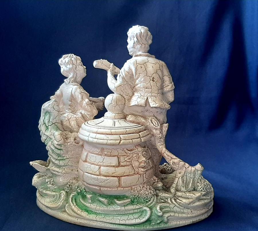 VINTAGE STATUE OF MAN SERENADING A WOMAN