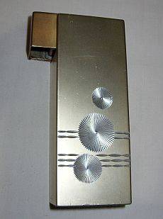 A large vintage electronic table lighter