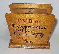 A vintage wooden money box with secret opening