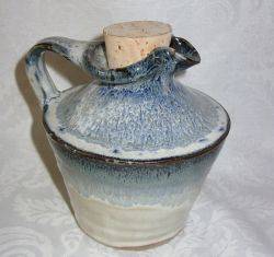 A POTTERY WINE VAT WITH MAKERS STAMP TO BASE