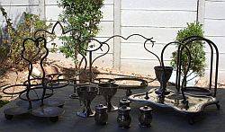 Assorted silver plate condiment holders plus salt and pepper holders and egg cups