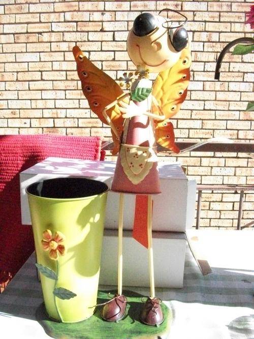 ***HUGE STANDING IRON DOLL WITH HUGE BUCKET FOR FLOWER *