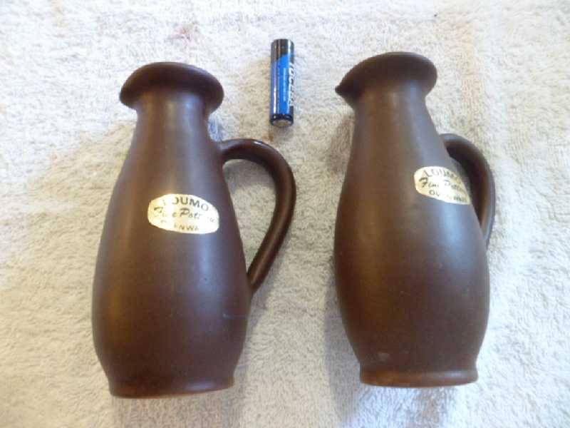 Two Loumo Jugs with Stoppers