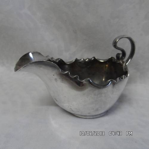 A BEAUTIFULLY FRILLY EDGED 'SAUCE' BOAT/JUG