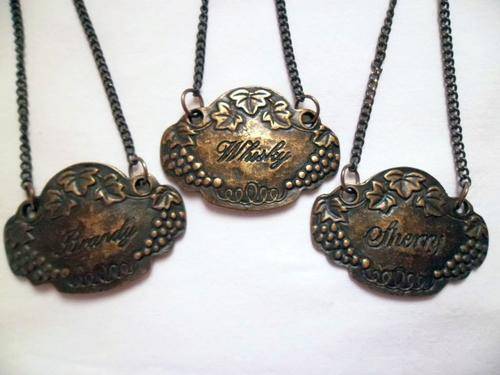 THREE SMALL VINTAGE BRONCE BOTTLE DECANTER LABELS HANG TAGS, WHISKY - BRANDY - SHERRY
