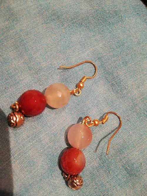 8 x dangle earrings, some with glass or gems. And one wire cross, Bulk sale together.