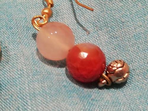 8 x dangle earrings, some with glass or gems. And one wire cross, Bulk sale together.